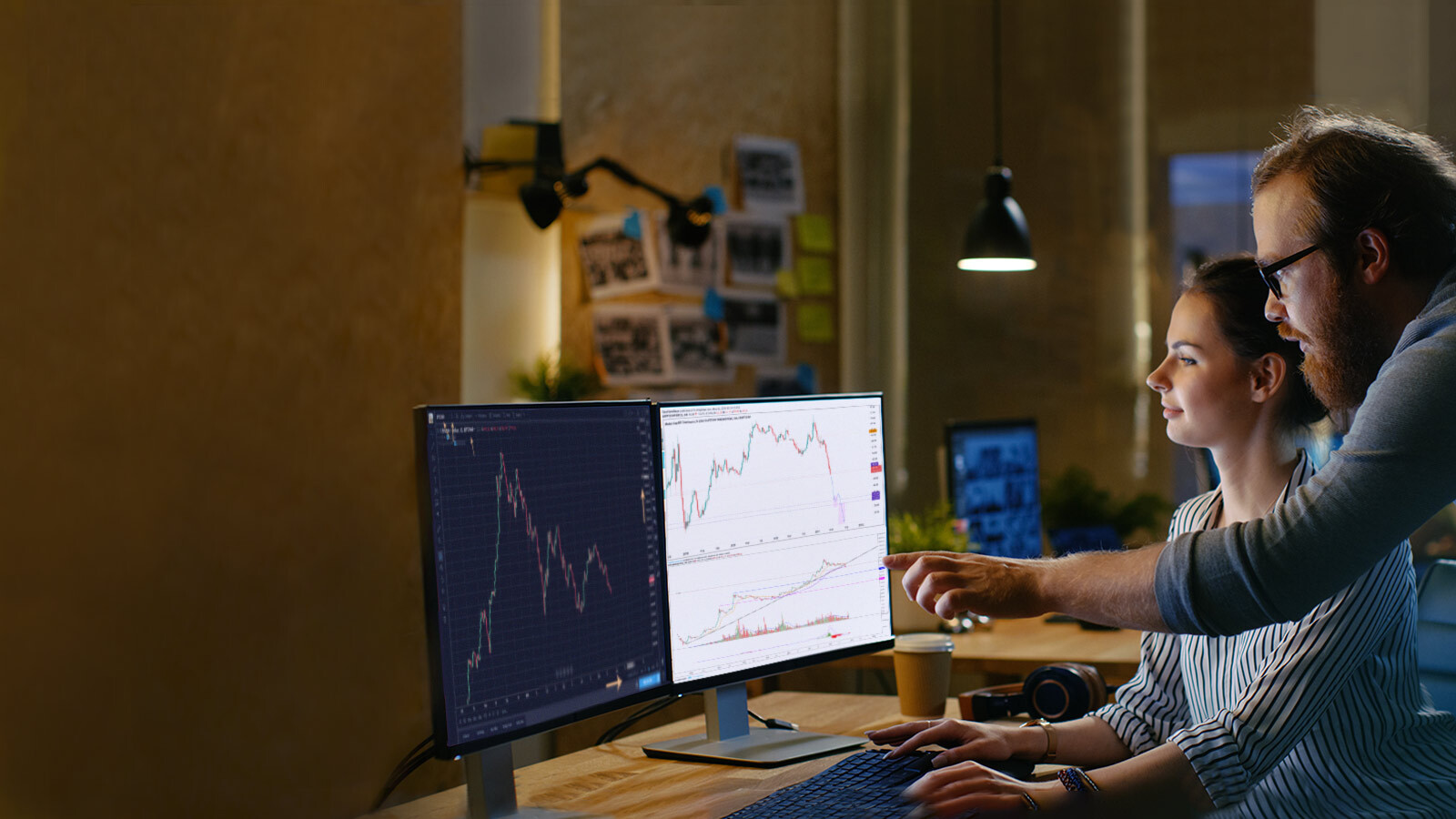 man and woman looking at crypto