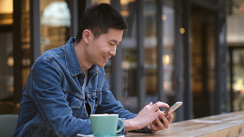 man with coffee and computer