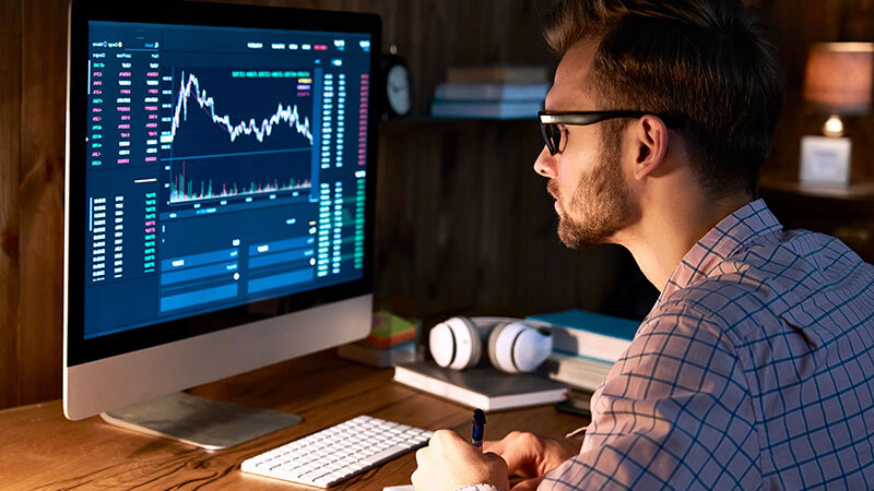 man looking at financial chart